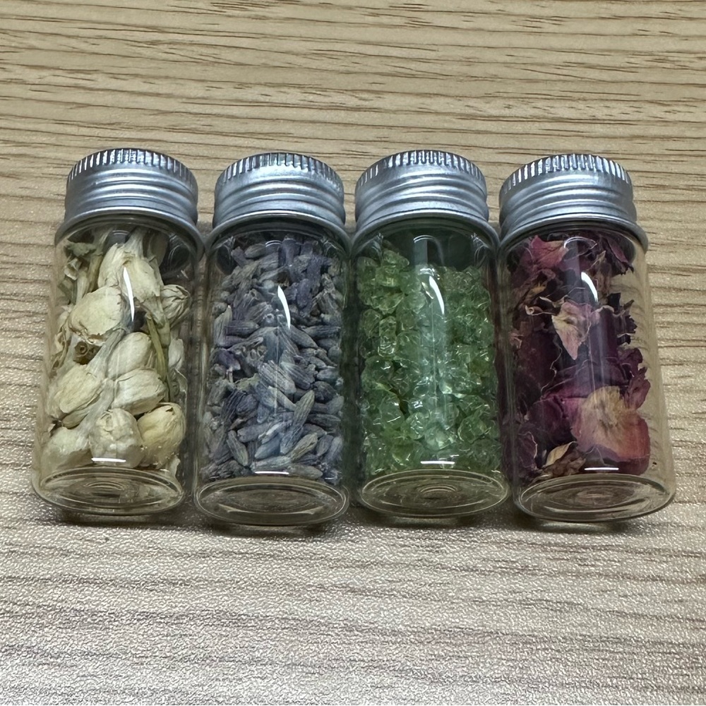Bundle of Four Vials of Herbs and Crystals